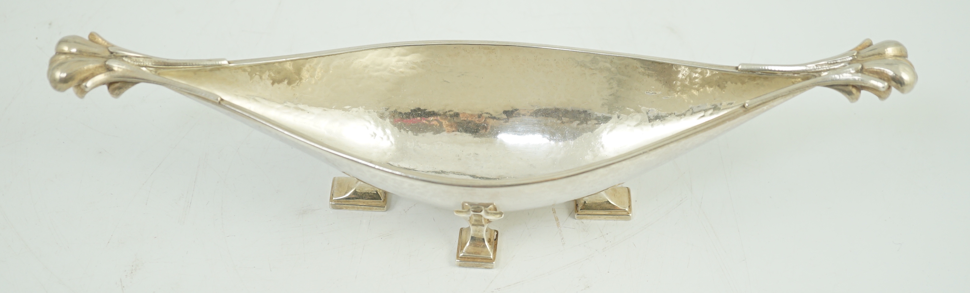 A George V Arts & Crafts planished silver boat shaped dish, by Omar Ramsden